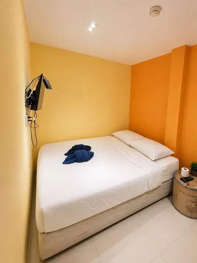 Compact private guest room at Au Bon Hostel